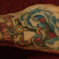 Tatuaje en la mano Ancla con la inscripción Just love
