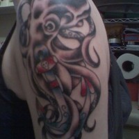 Octopus with anchor coloured tattoo