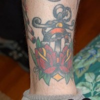 Anchor with roses coloured tattoo