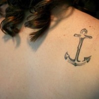 Classic steel anchor on shoulder