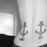 Two anchors tattoo on girl's back