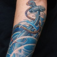 Beautiful storm and anchor tattoo on hand