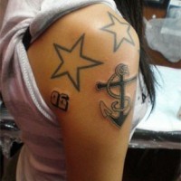 Anchor with stars black tattoo on shoulder