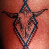 Skull with horns coloured tattoo