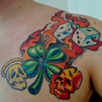 Angel and devil skull with dice and clover tattoo