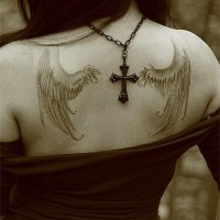 Wings tattoo on girl's back