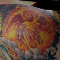 Colourful gentle archangel tattoo on shoulder