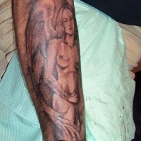 Naked female angel tattoo on leg