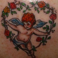 Cherub in heart of roses coloured tattoo