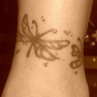 Cains of butterflies ankle tattoo