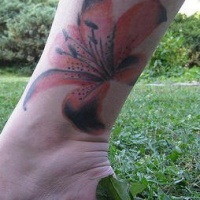 Red orchid ankle tattoo