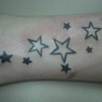 Black and white stars ankle tattoo
