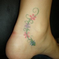 Thin plant with flowers ankle tattoo