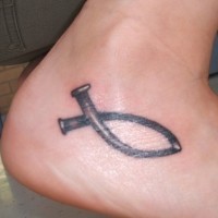 Black clamp ankle tattoo