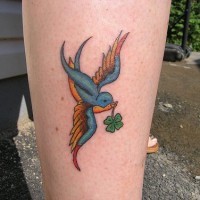 Bird with green leaf ankle tatto