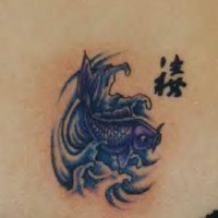 Small tattoo with blue fish and characters