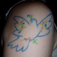 Pigeon arm tattoo