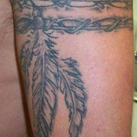 Black and white feathers on arm band