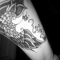Black wings arm tattoo