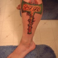 Coloured axe army tattoo on leg