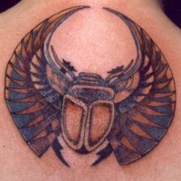 Sacred scarab coloured tattoo