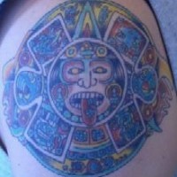Aztec sun stone coloured tattoo
