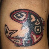 Tribal red and black fish tattoo