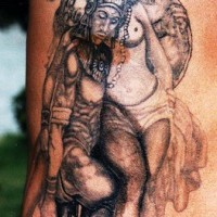Tatuaje de un guerrero azteca y una mujer desnuda.