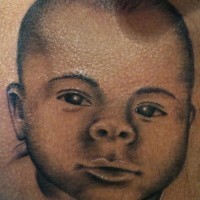 Little baby portrait tattoo