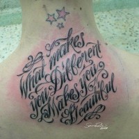Back of neck tattoo with text