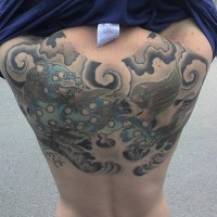 Monster flying on upper back  water tattoo