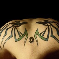 Two  similar monsters on upper back styled tattoo