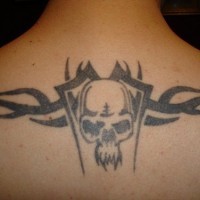 Evil skull tattoo styled on upper back