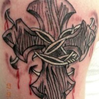 Barb wired cross with blood tattoo