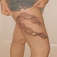 Flowers with barb wire tattoo on hip