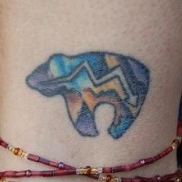 Bear symbol coloured tattoo