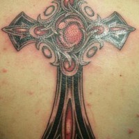 Bejeweled cross coloured tattoo