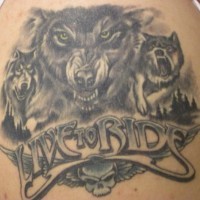 Biker wolf tattoo with inscription live to ride