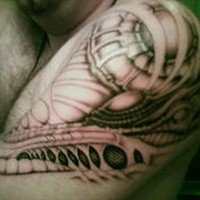 Biomechanical shoulder tattoo