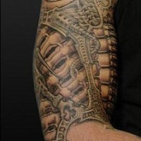 Biomechanical large arm tattoo