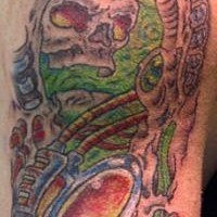 Biomechanical underworld coloured tattoo