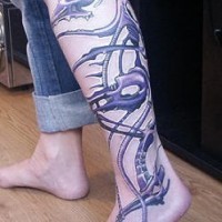 Biomech tracery tattoo on leg