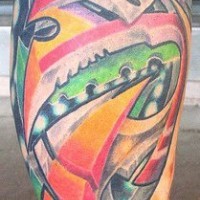 Surreal coloured tattoo on leg