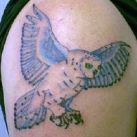 Polar owl in flight tattoo
