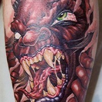 Evil red demon under skin rip tattoo