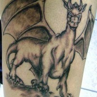 Dragon cow tattoo in black ink