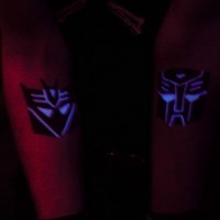 Autobot and decepticon glowing tattoo