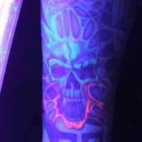 Demonic skull uv ink tattoo