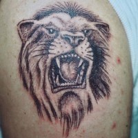 Black roaring lion tattoo