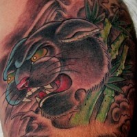 Black panther in bamboo forest tattoo